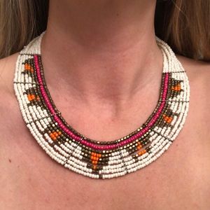 Crescent shaped multi strand beaded necklace